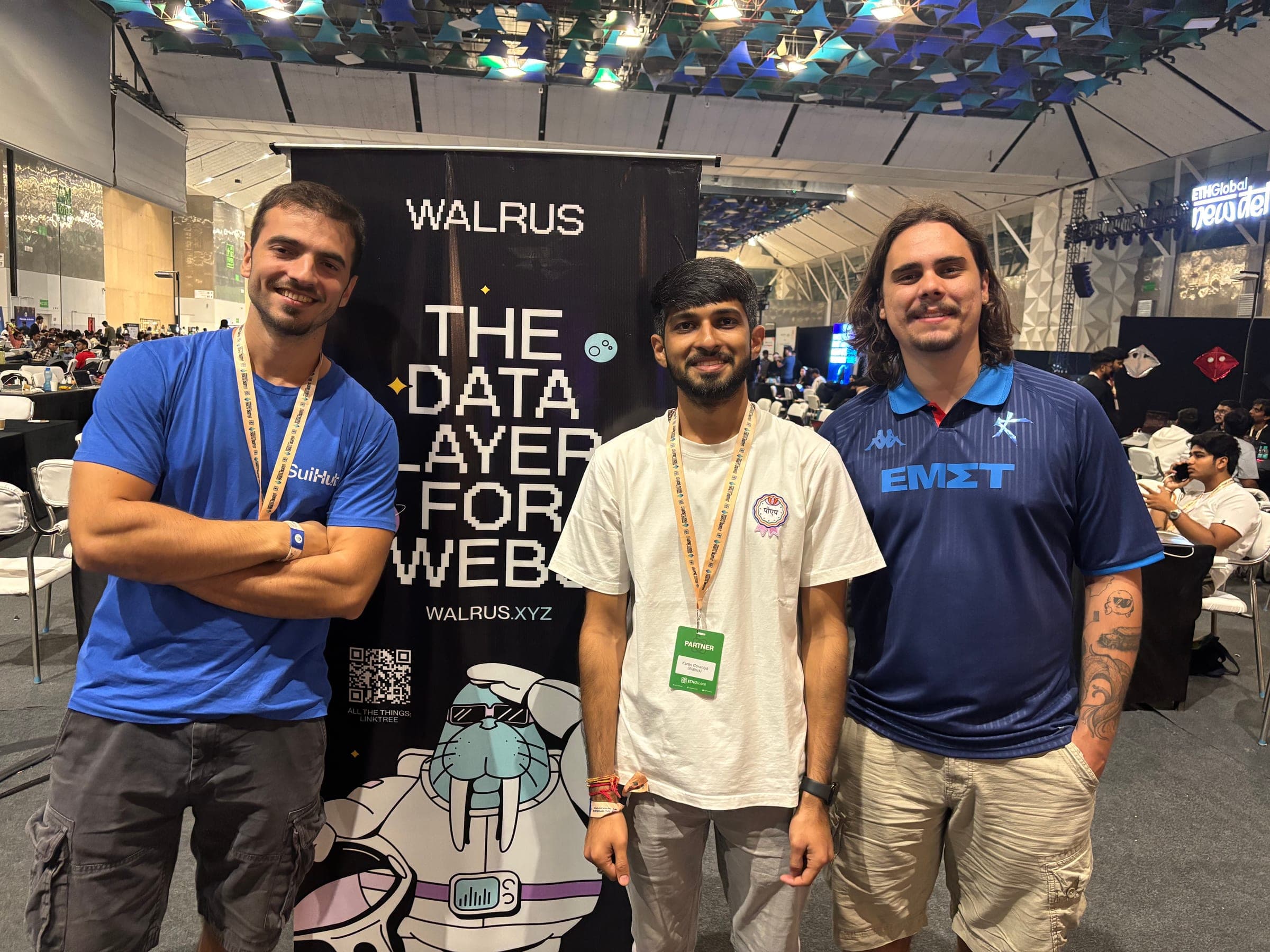 Guilherme with two builders in front of the Walrus banner at ETHGlobal New Delhi.